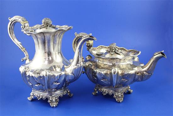 An ornate late William IV silver coffee pot and Victorian teapot.